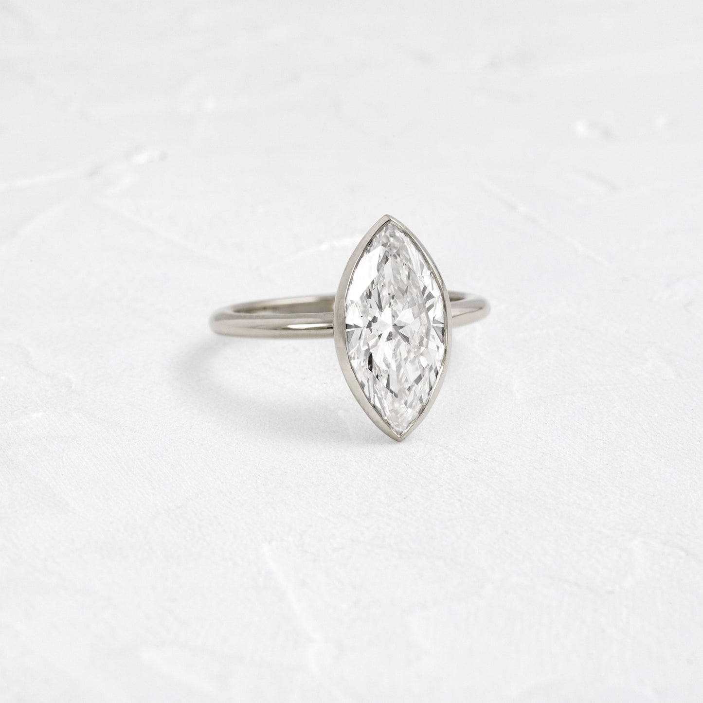 Solitaire Bezel with Hidden Stones-Marquise Lab Grown Diamond Engagement Ring - On model