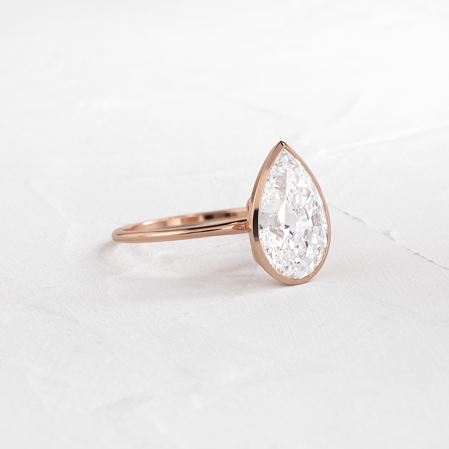 Solitaire Bezel with Hidden Stones-Pear Lab Grown Diamond Engagement Ring - Back view