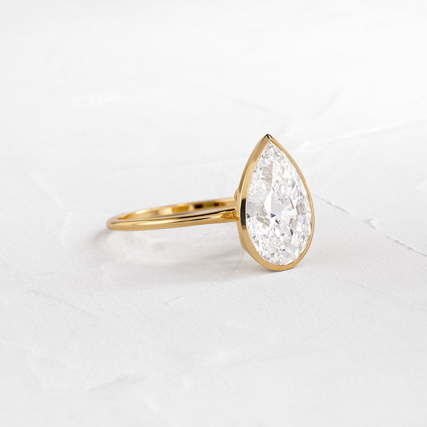 Solitaire Bezel with Hidden Stones-Pear Lab Grown Diamond Engagement Ring - Front view