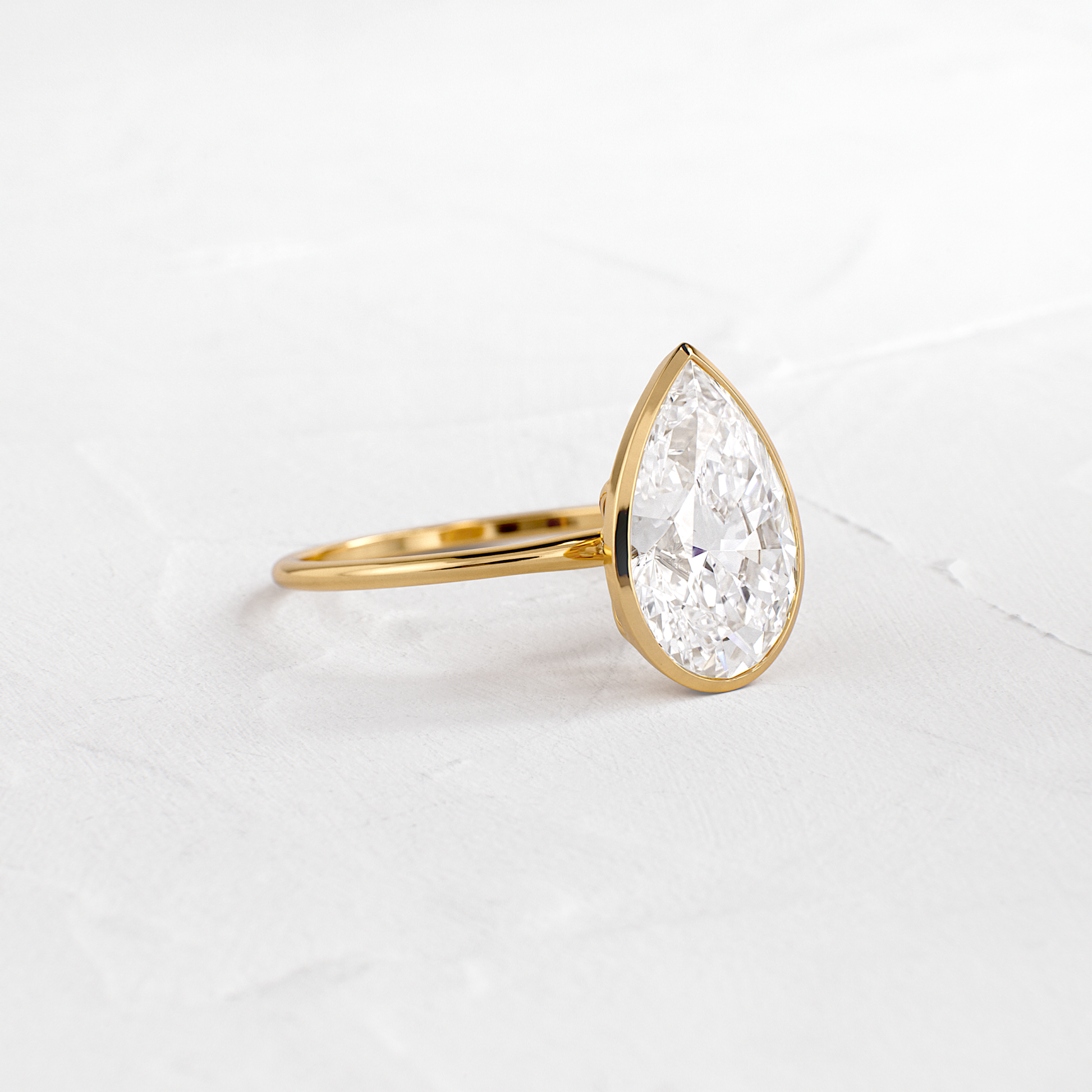 Solitaire Bezel with Hidden Stones-Pear Lab Grown Diamond Engagement Ring - Front view