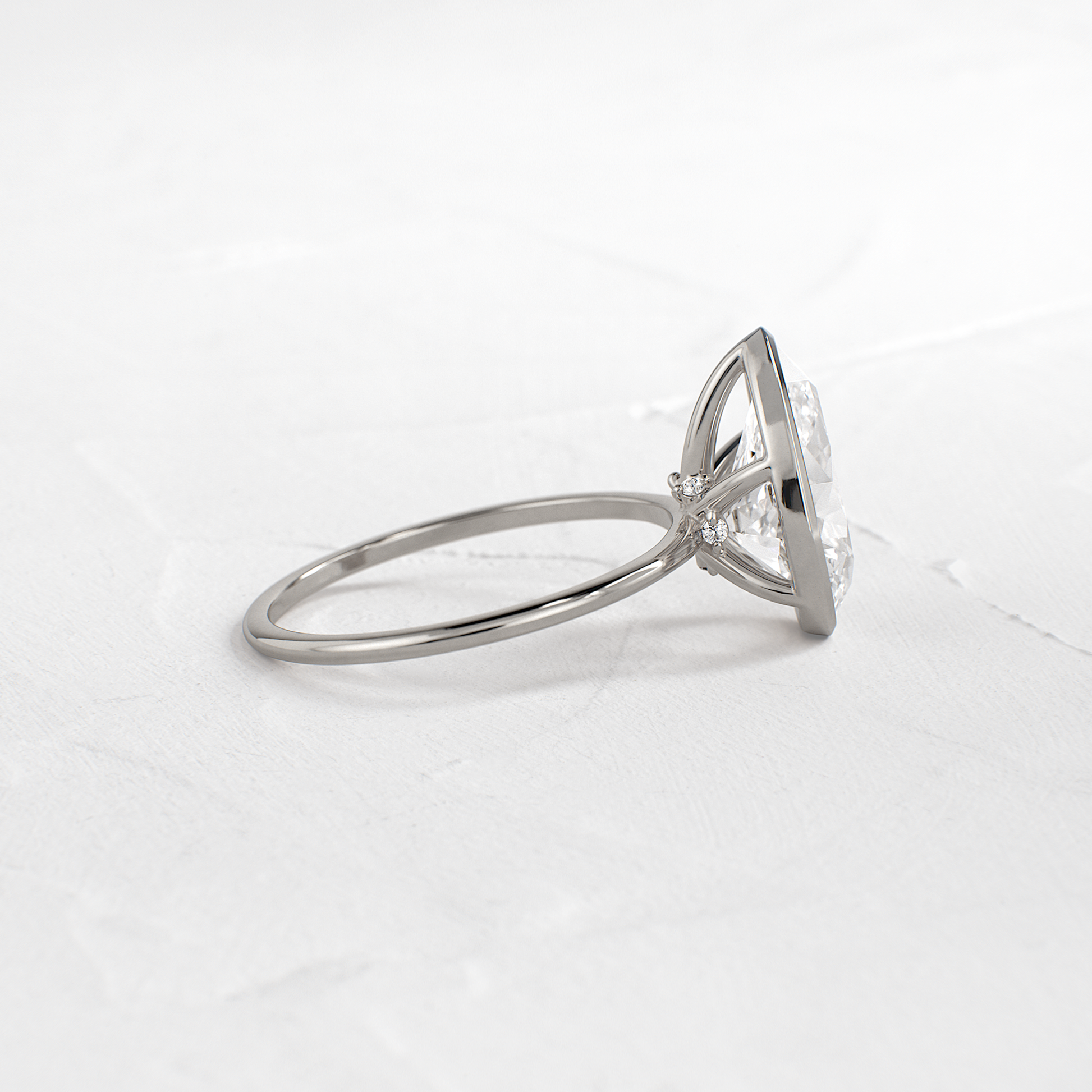 Solitaire Bezel with Hidden Stones-Pear Lab Grown Diamond Engagement Ring - Lifestyle