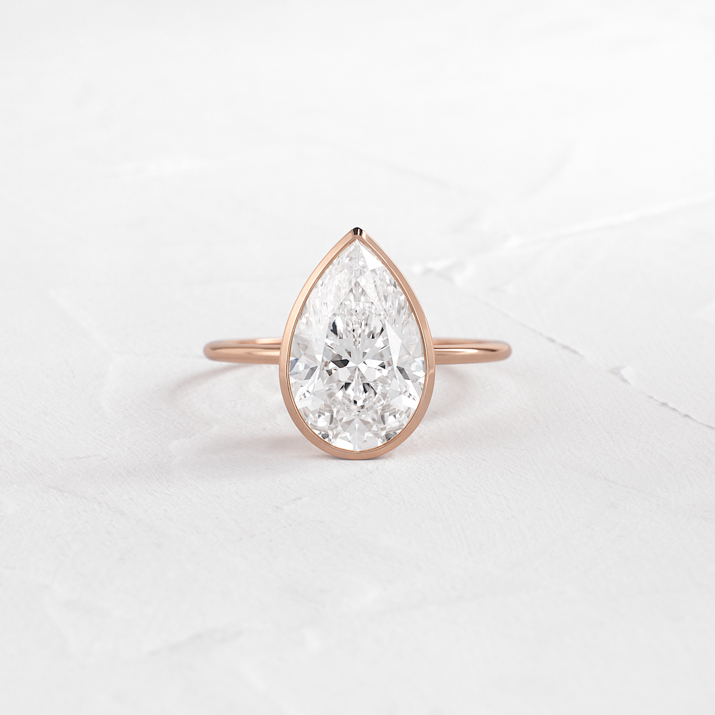 Solitaire Bezel with Hidden Stones-Pear Lab Grown Diamond Engagement Ring - Side view