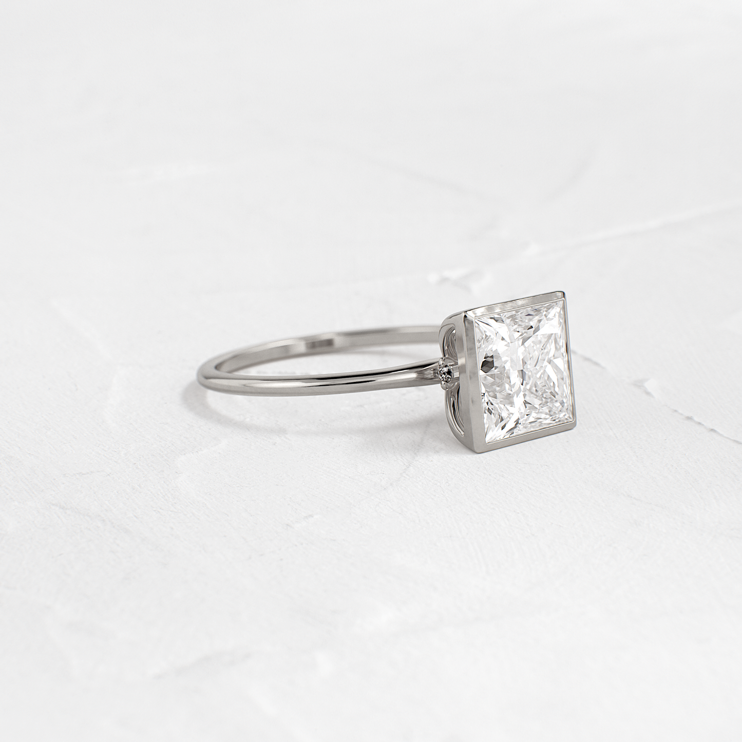 Solitaire Bezel with Hidden Stones-Princess Lab Grown Diamond Engagement Ring - On model