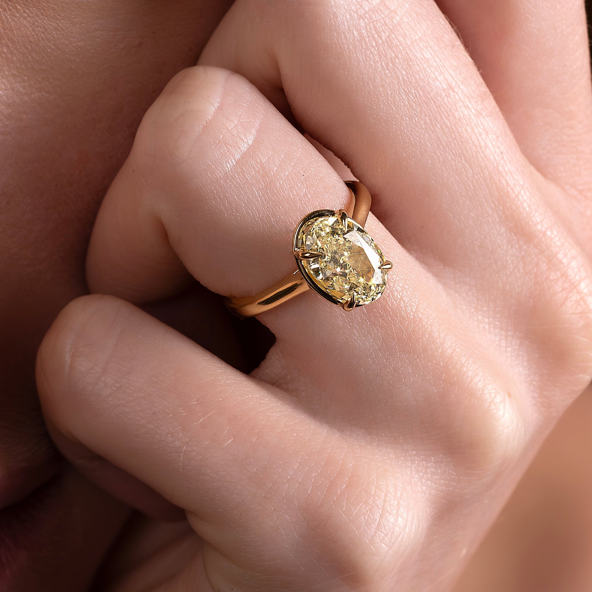 Solitaire Cathedral Unique Bezel- 2.1 CT Oval Moissanite Engagement RingSolitaire Cathedral Unique Bezel- 2.1 CT Oval Moissanite Engagement Ring - Side view