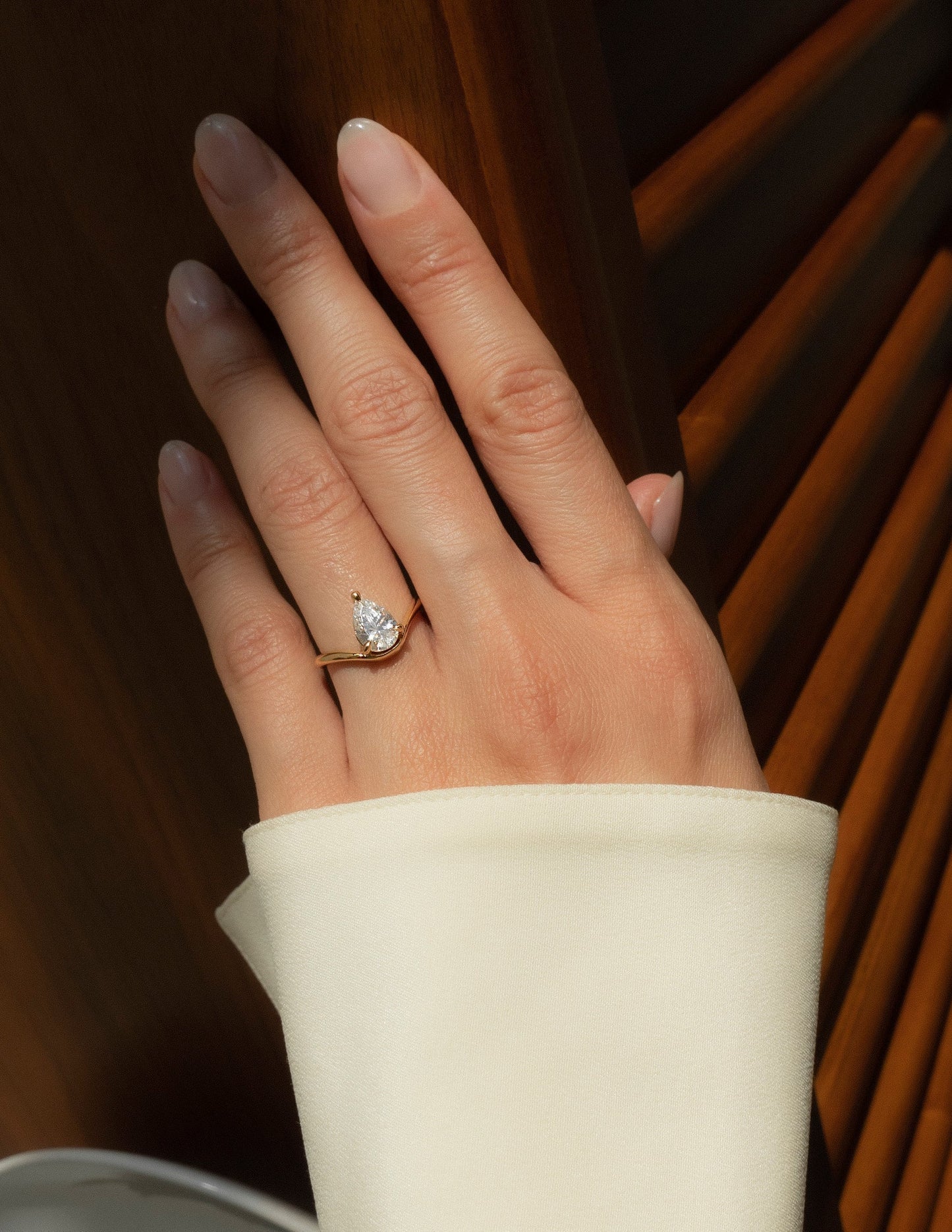 Solitaire Curved Shank-Pear Lab Grown Diamond Engagement Ring - On model