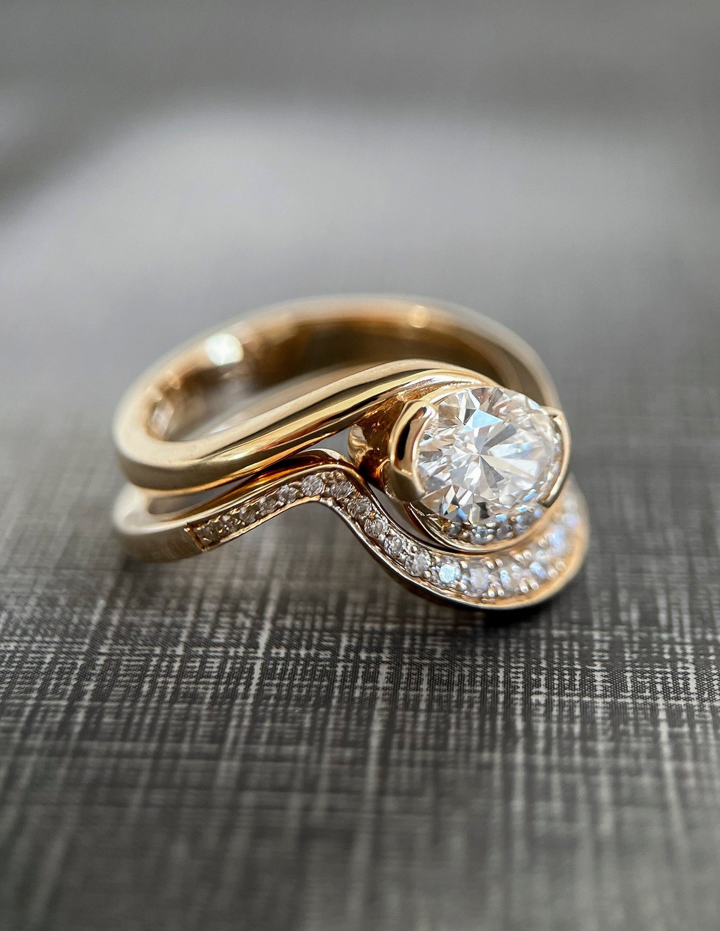 Solitaire Half Bezel Rapture & Pave Band- 1 CT Oval Lab Grown Diamond Bridal SetSolitaire Half Bezel Rapture & Pave Band- 1 CT Oval Lab Grown Diamond Bridal Set - Detail view
