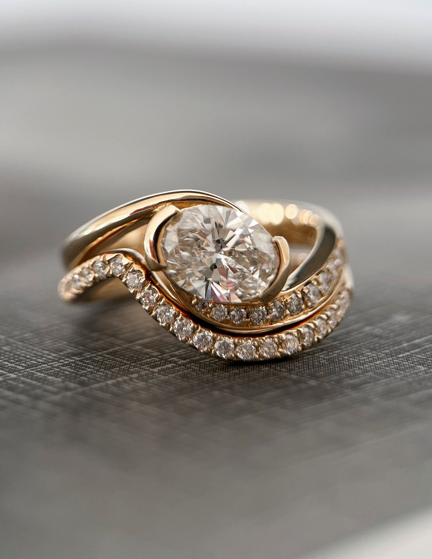 Solitaire Half Bezel Rapture & Pave Band- 1 CT Oval Lab Grown Diamond Bridal SetSolitaire Half Bezel Rapture & Pave Band- 1 CT Oval Lab Grown Diamond Bridal Set - Lifestyle