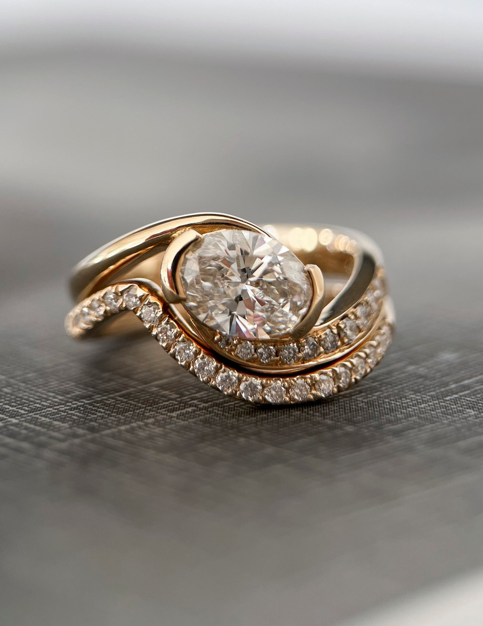 Solitaire Half Bezel Rapture & Pave Band- 1 CT Oval Lab Grown Diamond Bridal SetSolitaire Half Bezel Rapture & Pave Band- 1 CT Oval Lab Grown Diamond Bridal Set - Lifestyle