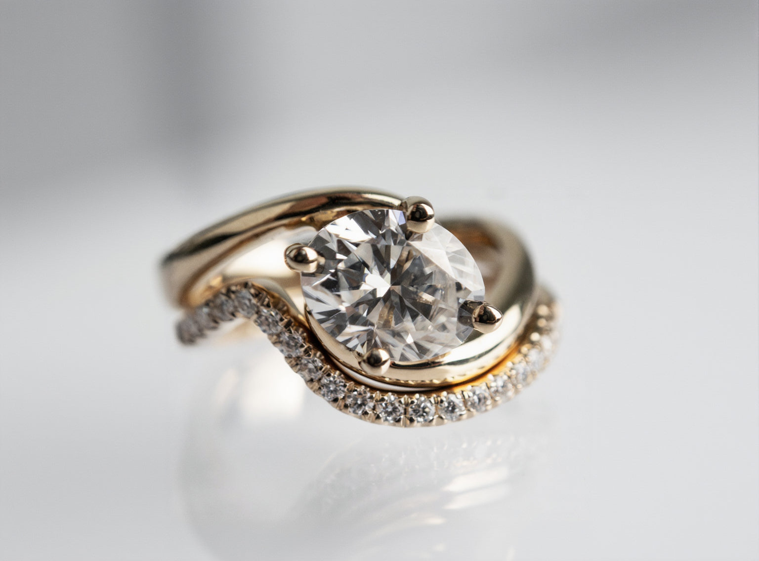 Solitaire Rapture Compass Prong & Pave Band- 1 CT Oval Lab Grown Diamond Bridal SetSolitaire Rapture Compass Prong & Pave Band- 1 CT Oval Lab Grown Diamond Bridal Set - Back view