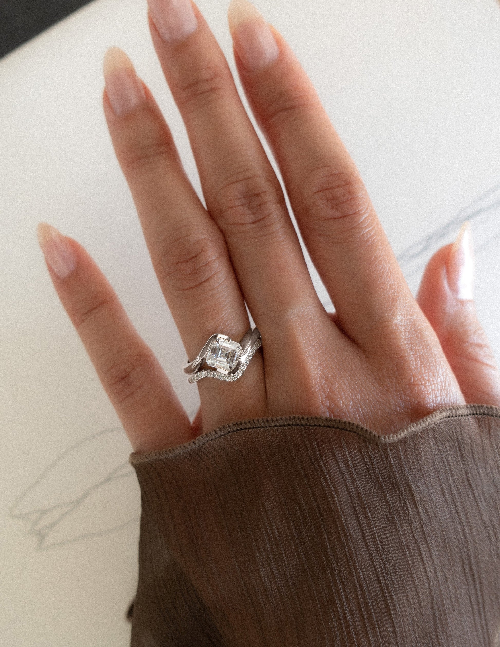 Solitaire Rapture Half Bezel & Pave Band- 1.5 CT Asscher Lab Grown Diamond Bridal SetSolitaire Rapture Half Bezel & Pave Band- 1.5 CT Asscher Lab Grown Diamond Bridal Set - Lifestyle