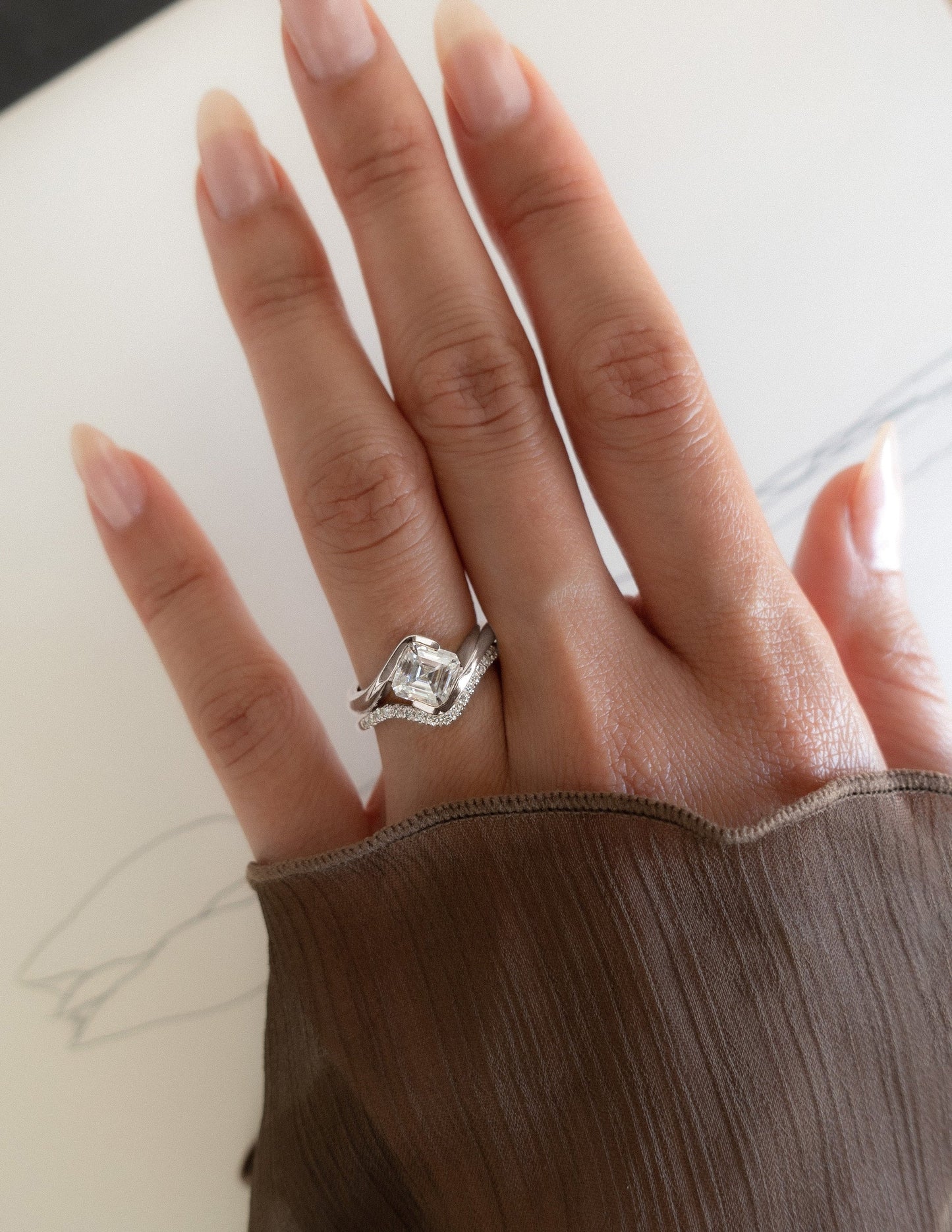 Solitaire Rapture Half Bezel & Pave Band- 1.5 CT Asscher Lab Grown Diamond Bridal SetSolitaire Rapture Half Bezel & Pave Band- 1.5 CT Asscher Lab Grown Diamond Bridal Set - Lifestyle