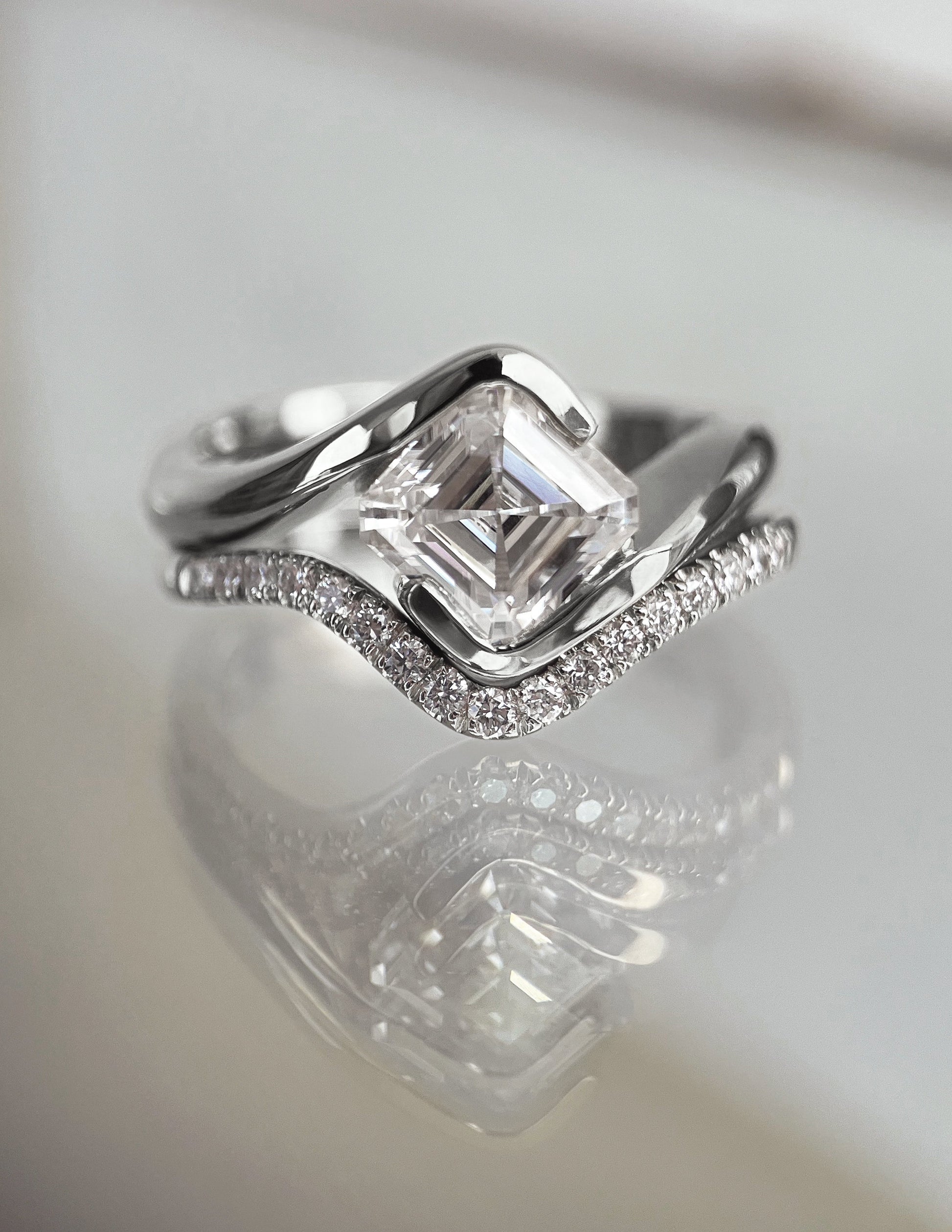 Solitaire Rapture Half Bezel & Pave Band- 1.5 CT Asscher Lab Grown Diamond Bridal SetSolitaire Rapture Half Bezel & Pave Band- 1.5 CT Asscher Lab Grown Diamond Bridal Set - Side view