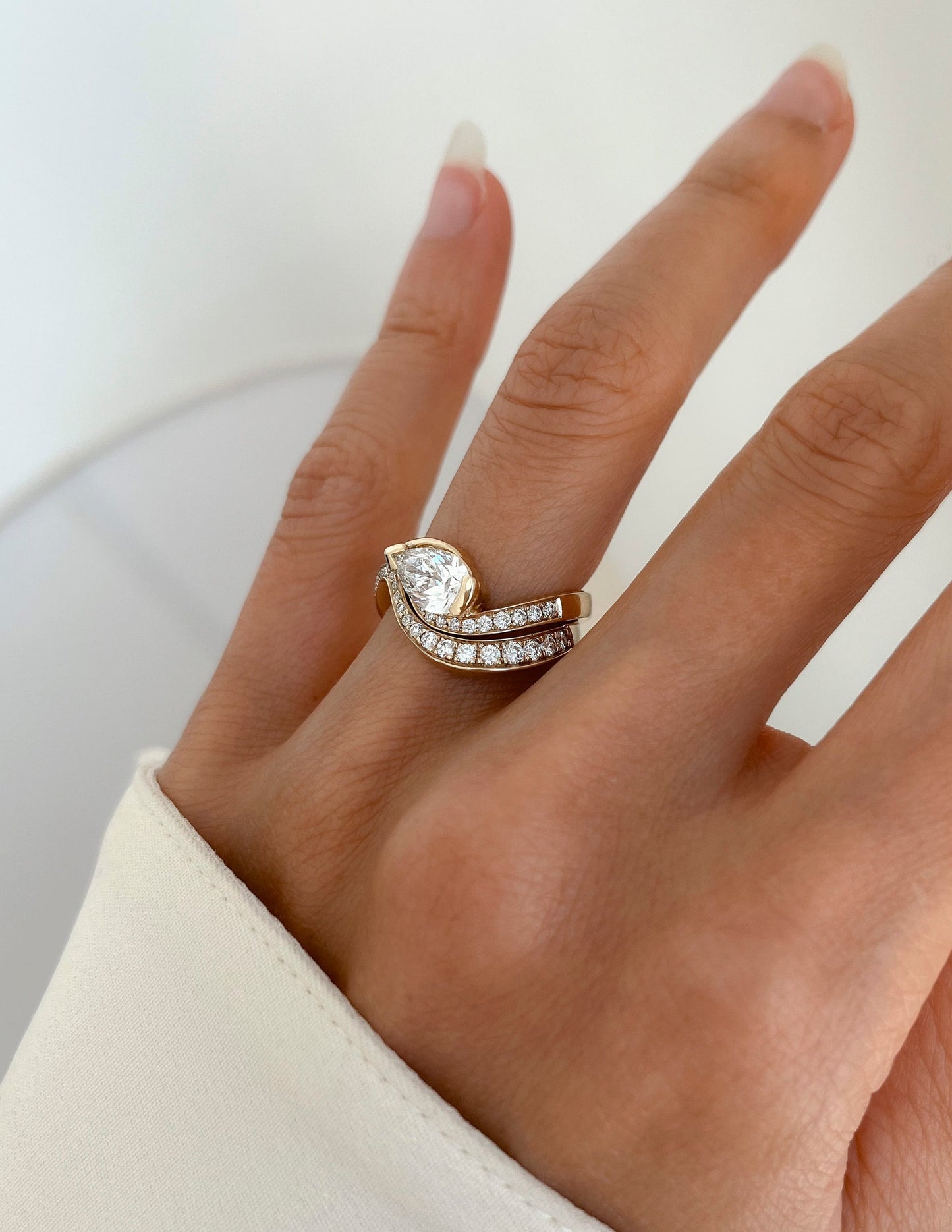 Solitaire Rapture & Pave Band- 1 CT Pear Lab Grown Diamond Bridal SetSolitaire Rapture & Pave Band- 1 CT Pear Lab Grown Diamond Bridal Set - On model