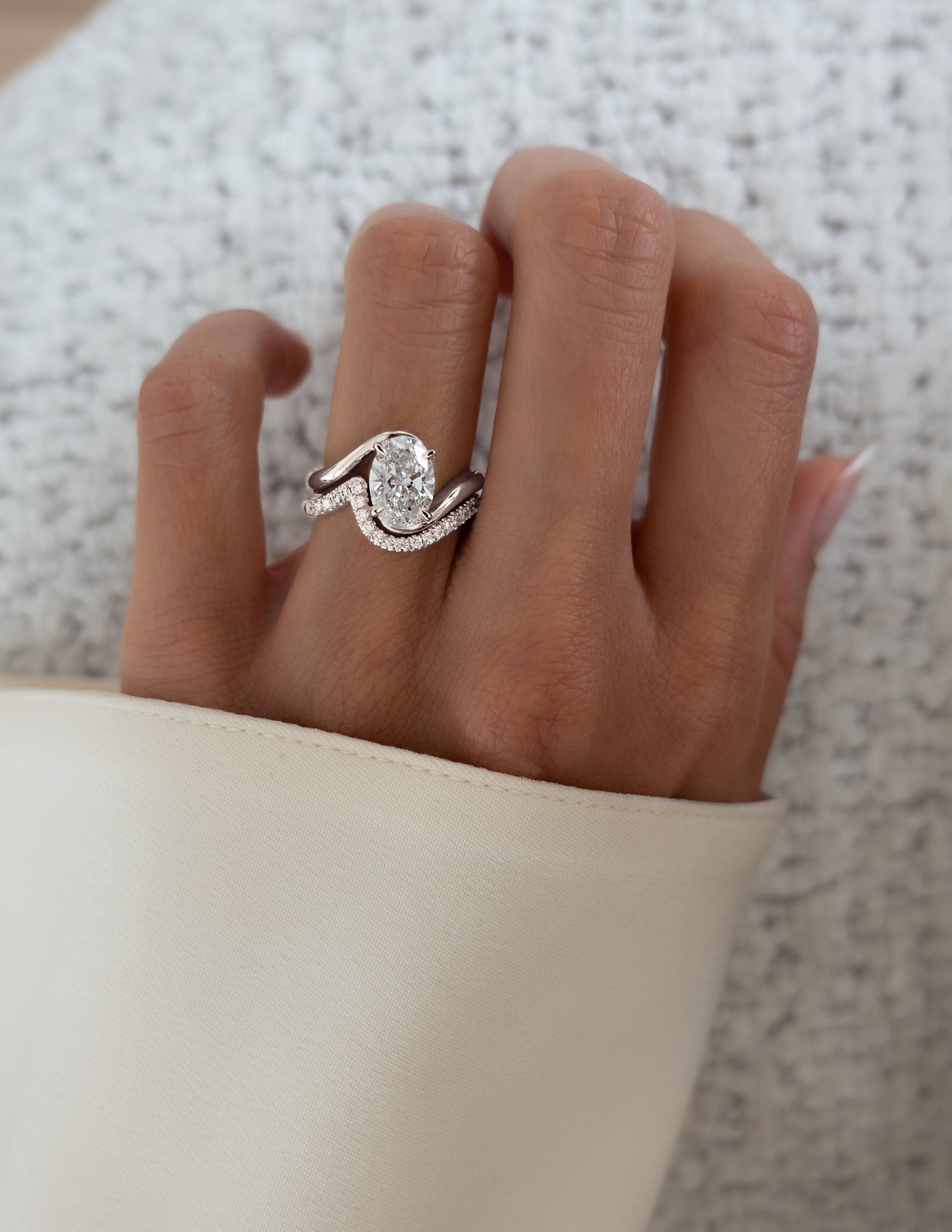 Solitaire Rapture & Pave Band- 2.5 CT Oval Lab Grown Diamond Bridal SetSolitaire Rapture & Pave Band- 2.5 CT Oval Lab Grown Diamond Bridal Set - On model