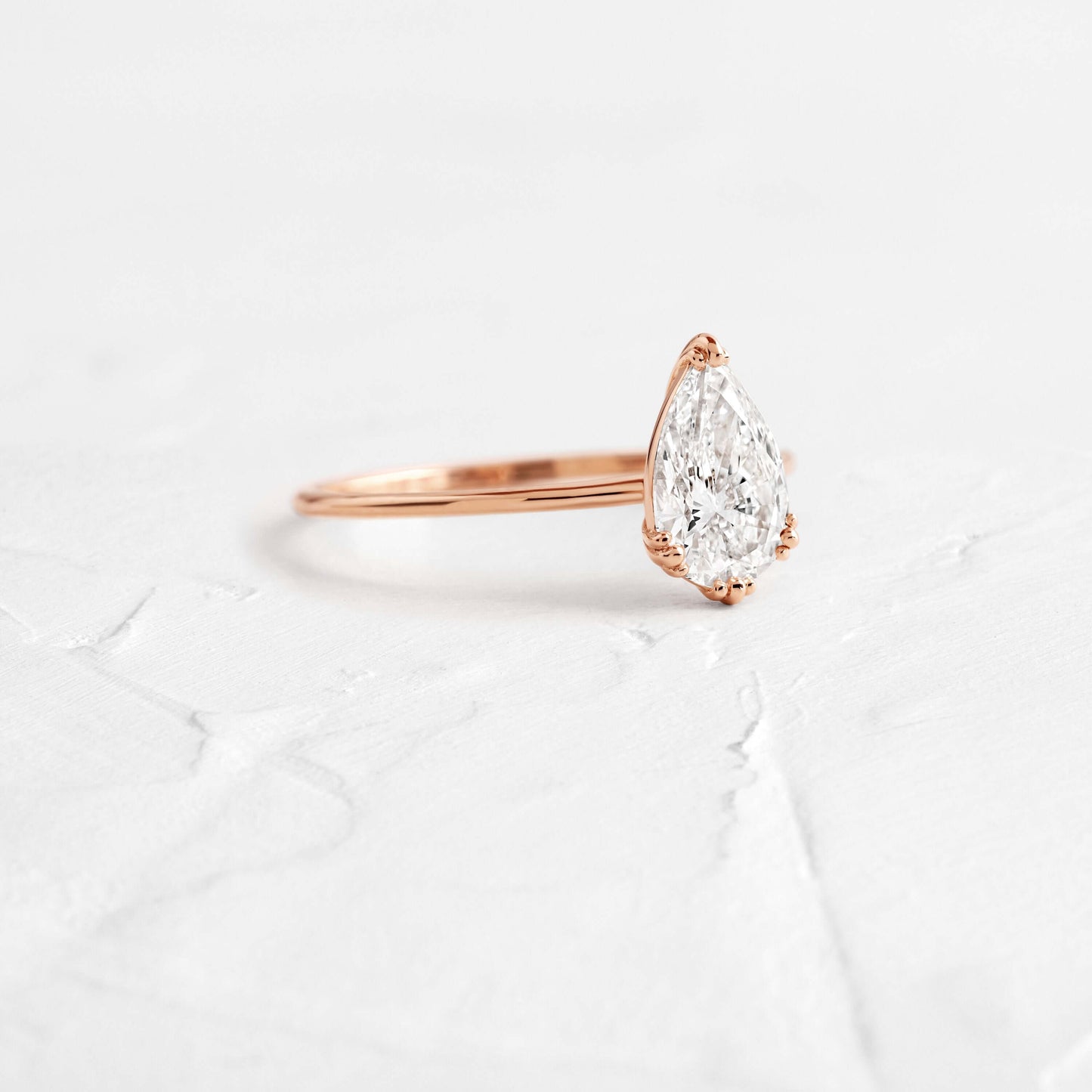 Solitaire Triple Prong-Pear Lab Grown Diamond Engagement Ring - On model