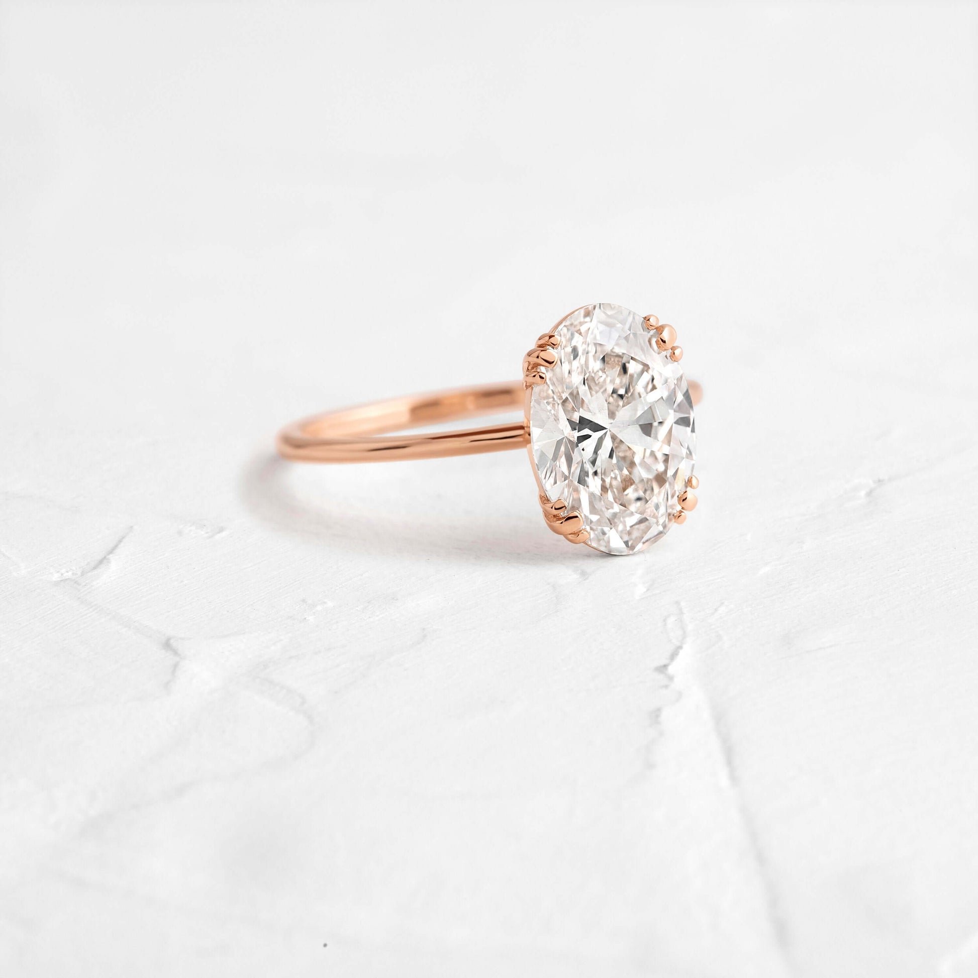 Solitaire Triple Prong with Hidden Stones-Oval Lab Grown Diamond Engagement Ring - Back view