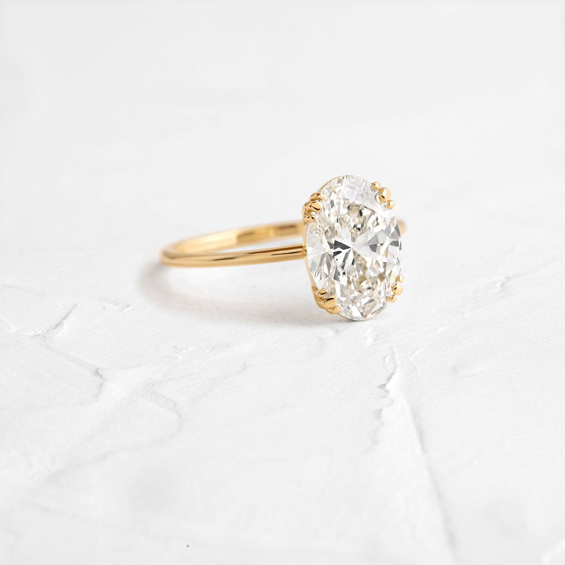 Solitaire Triple Prong with Hidden Stones-Oval Lab Grown Diamond Engagement Ring - Front view
