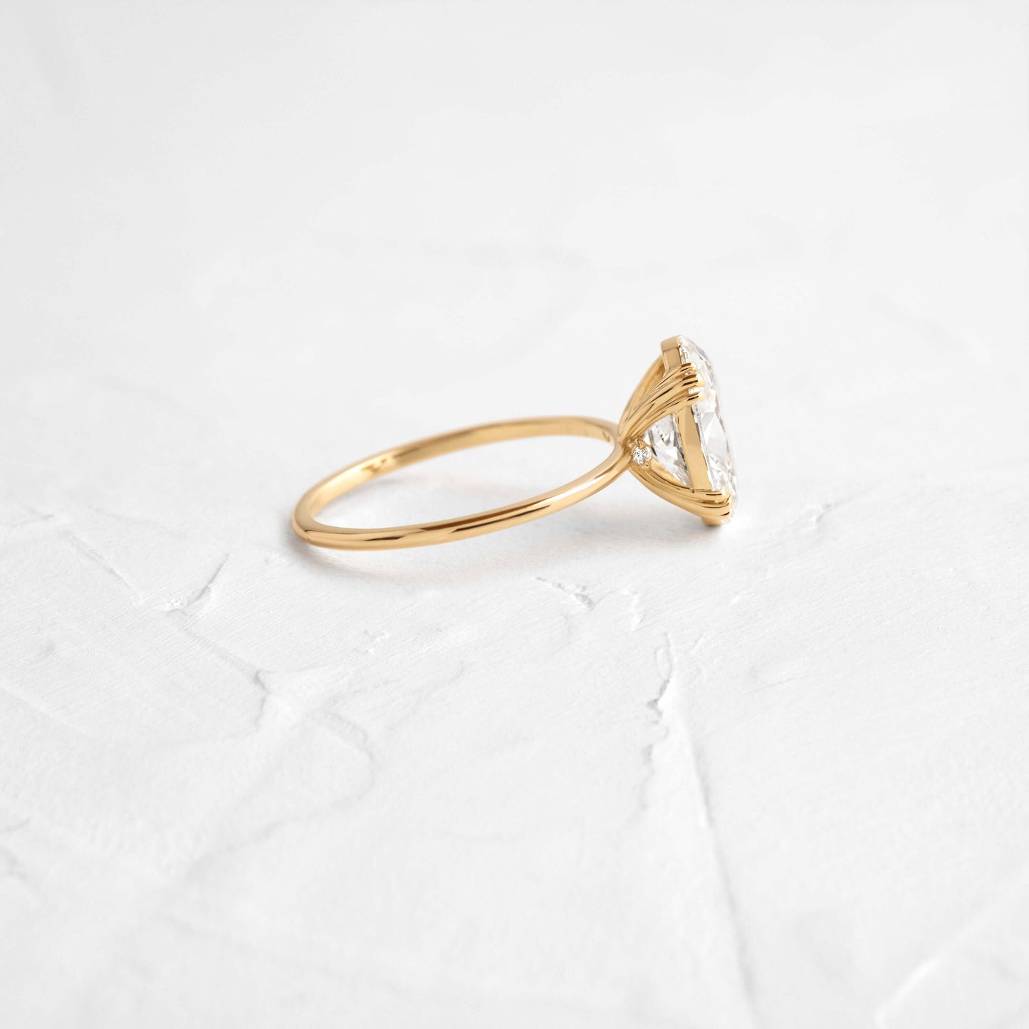 Solitaire Triple Prong with Hidden Stones-Oval Lab Grown Diamond Engagement Ring - Side view