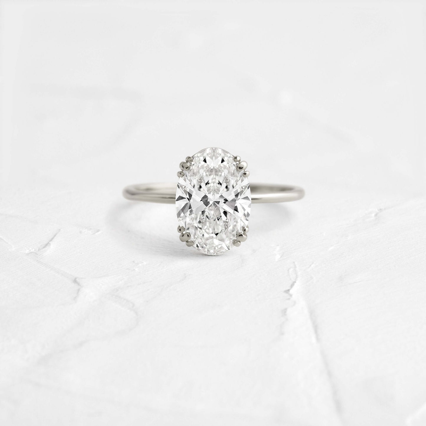 Solitaire Triple Prong with Hidden Stones-Oval Lab Grown Diamond Engagement Ring - Detail view