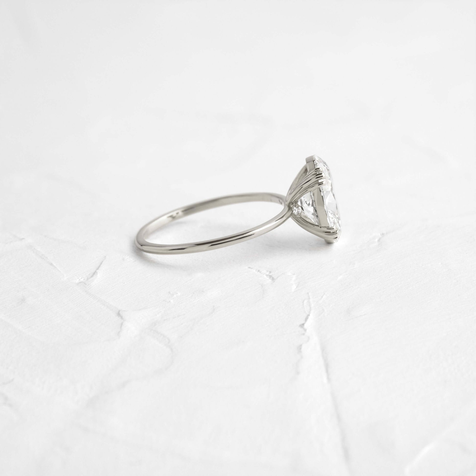 Solitaire Triple Prong with Hidden Stones-Oval Lab Grown Diamond Engagement Ring - Lifestyle