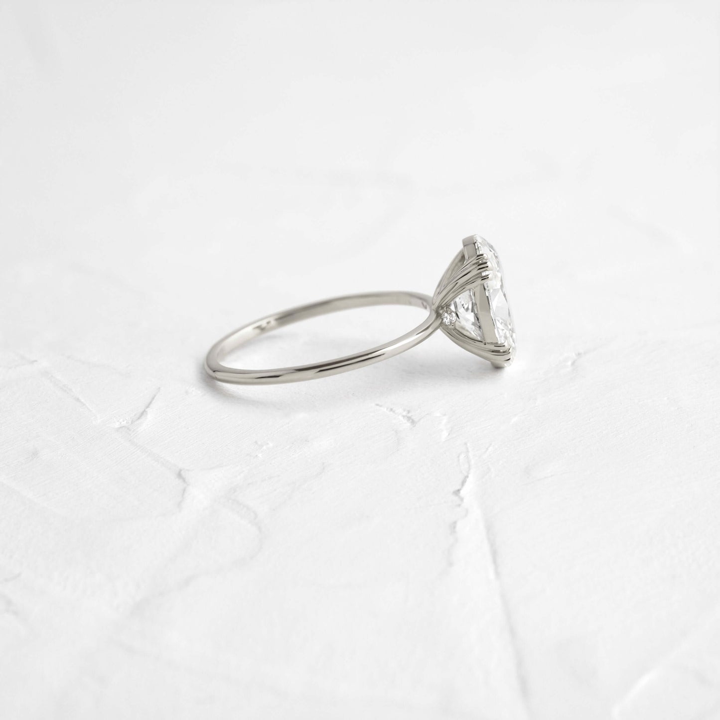 Solitaire Triple Prong with Hidden Stones-Oval Lab Grown Diamond Engagement Ring - Lifestyle