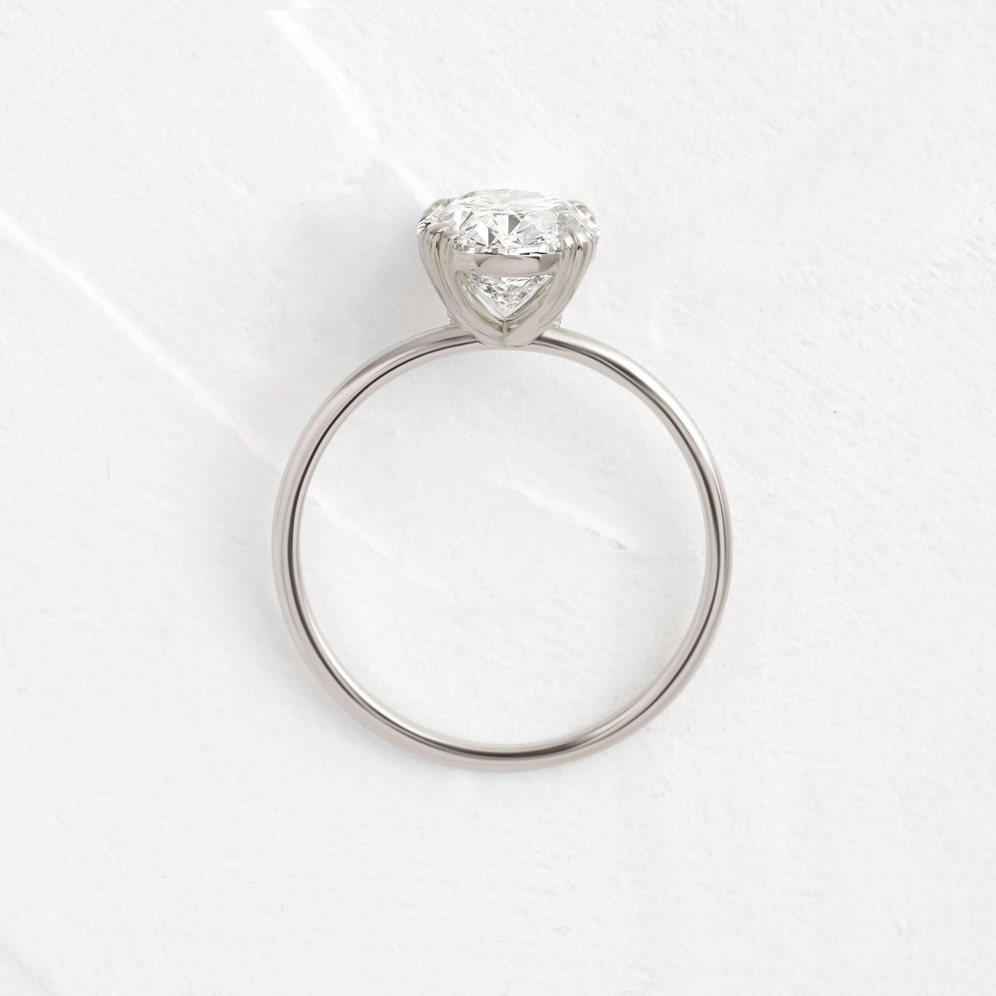 Solitaire Triple Prong with Hidden Stones-Oval Lab Grown Diamond Engagement Ring - Front view