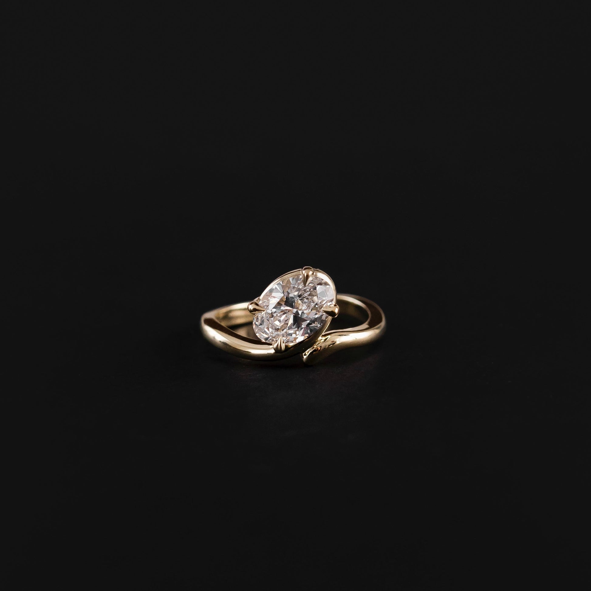 Solitaire Twisted Band- 2.1 CT Oval Moissanite Engagement RingSolitaire Twisted Band- 2.1 CT Oval Moissanite Engagement Ring - Side view