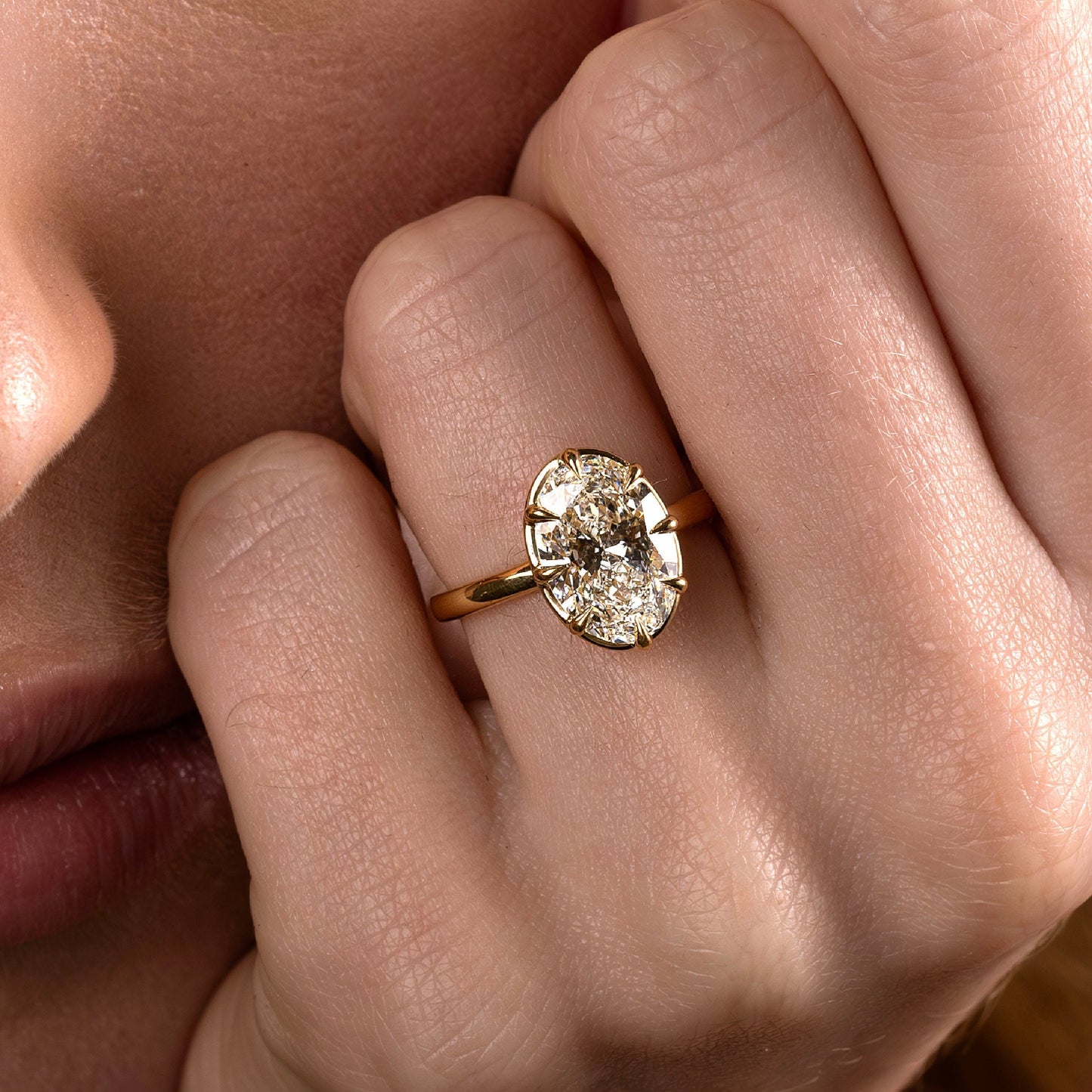 Solitaire Unique Bezel Low Profile-Oval Lab Grown Diamond Engagement Ring - On model