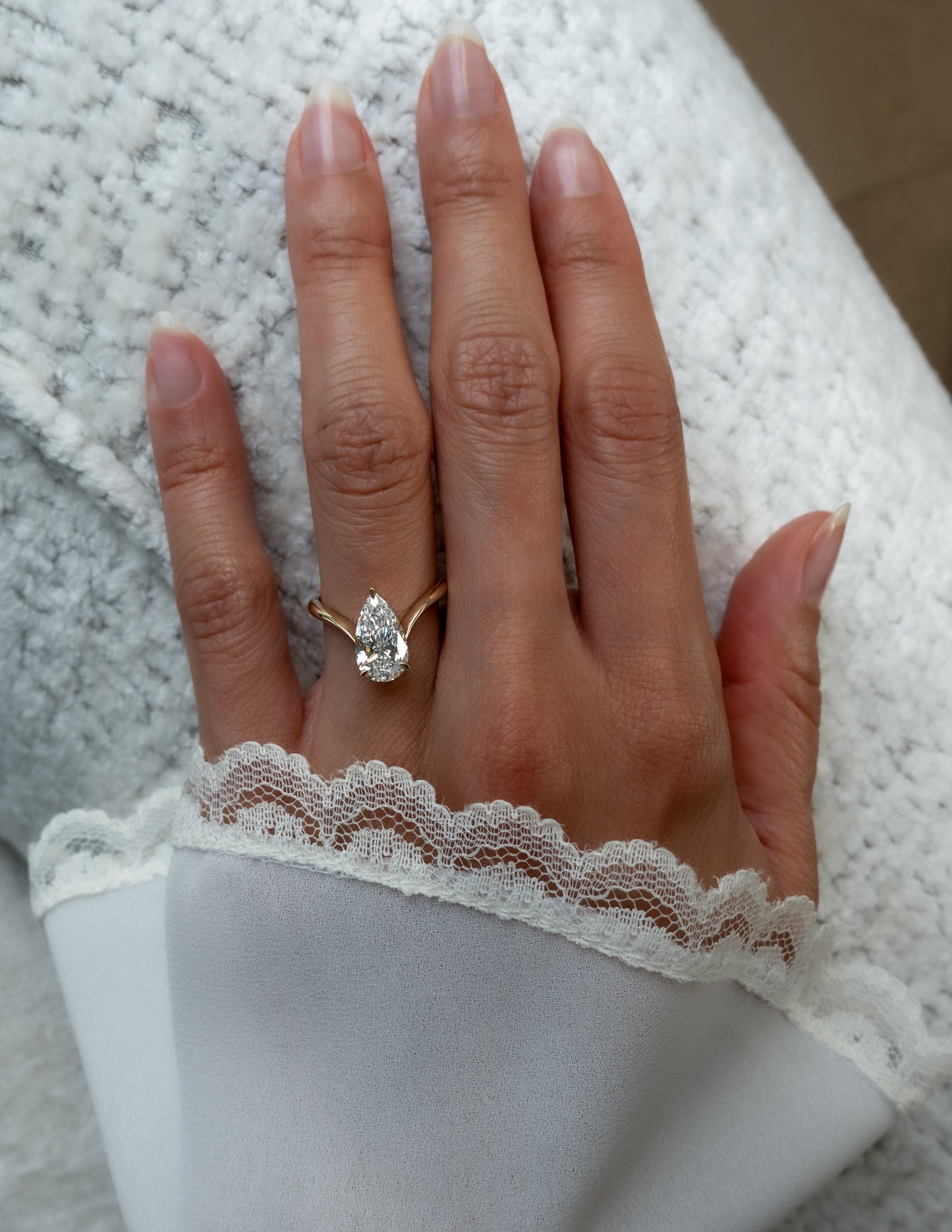 Solitaire V Curved Shank-Pear Lab Grown Diamond Engagement Ring - On model