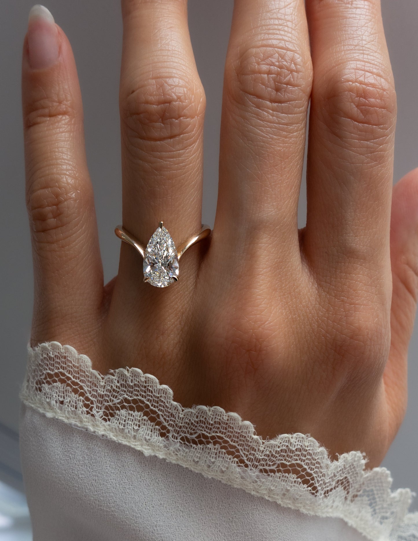 Solitaire V Curved Shank-Pear Lab Grown Diamond Engagement Ring - Lifestyle