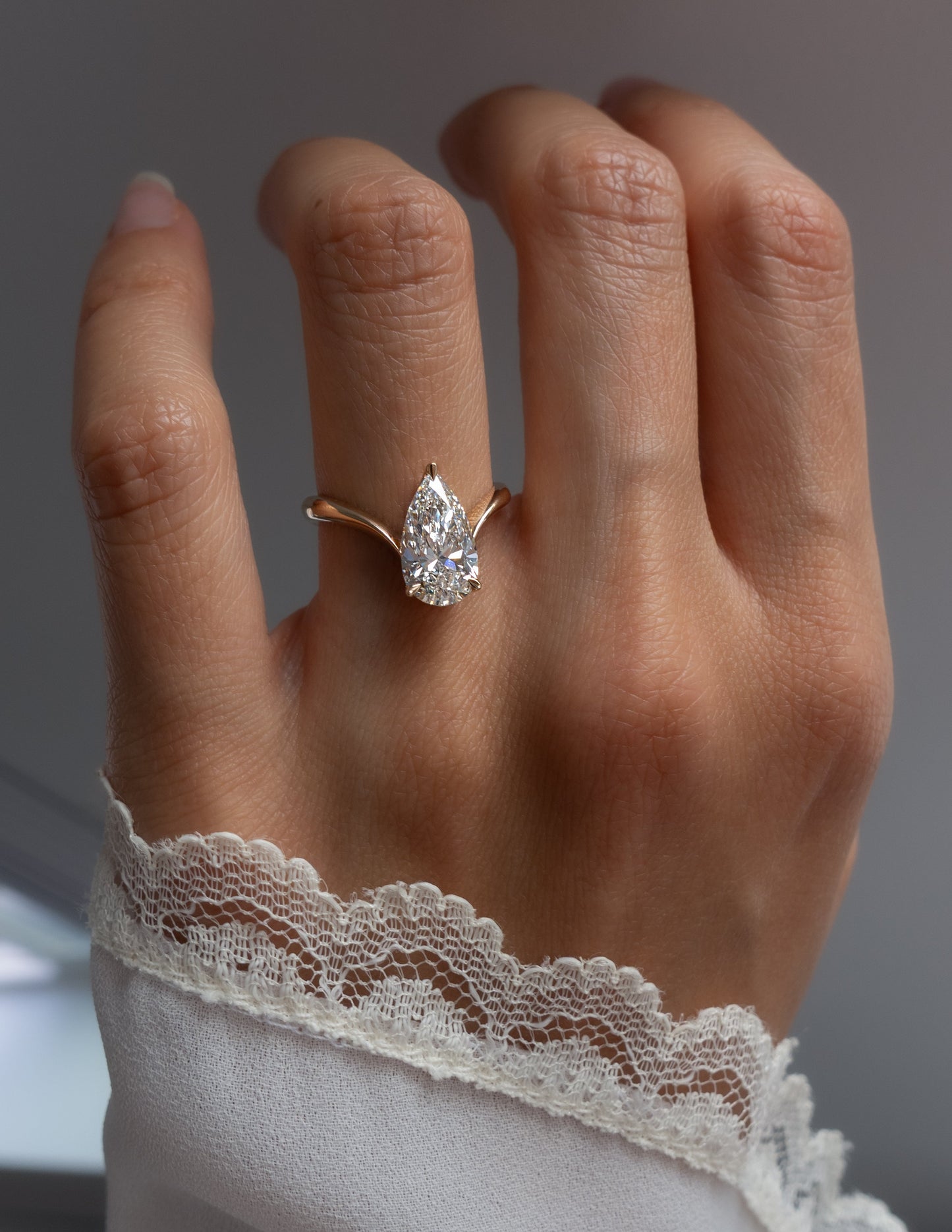 Solitaire V Curved Shank-Pear Lab Grown Diamond Engagement Ring - Front view