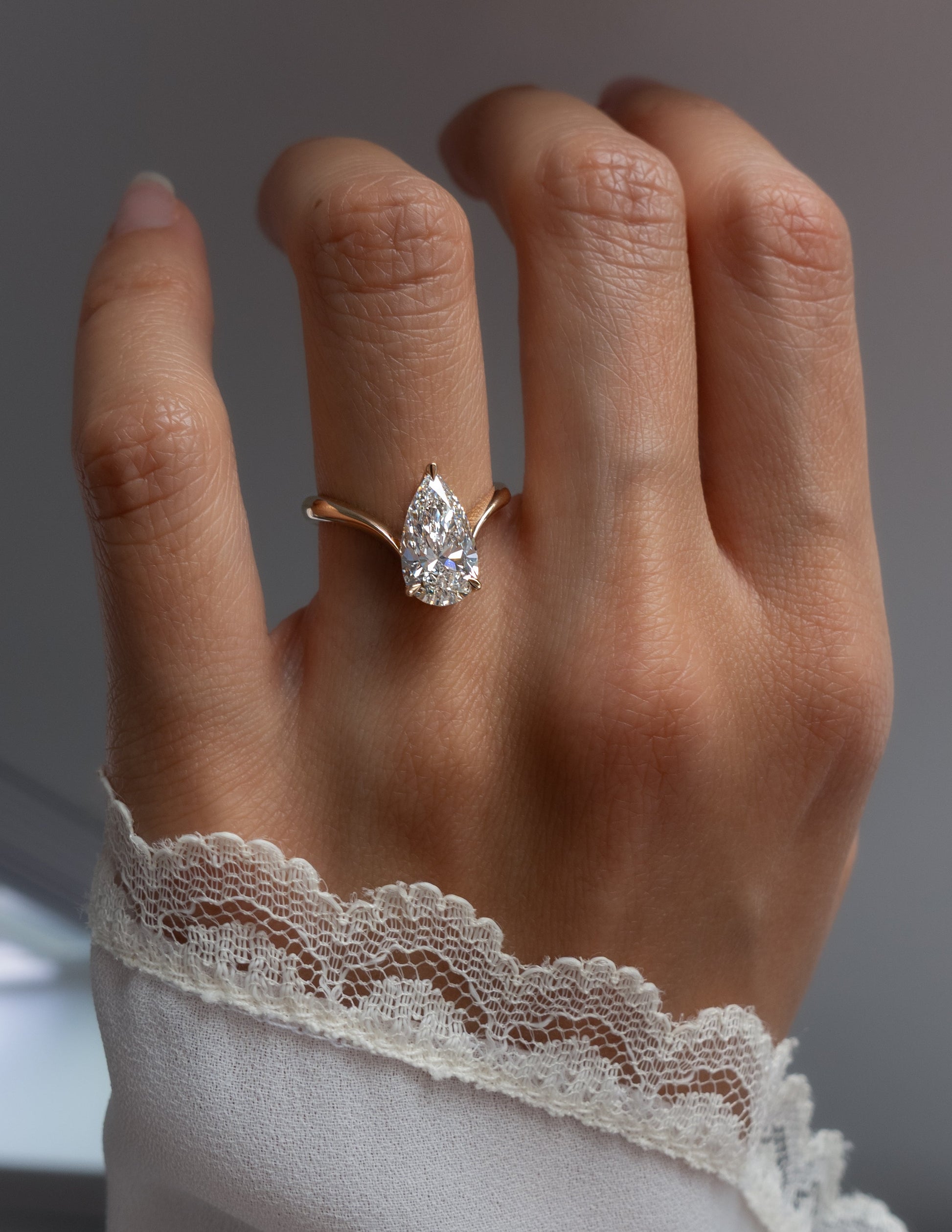 Solitaire V Curved Shank-Pear Lab Grown Diamond Engagement Ring - Front view