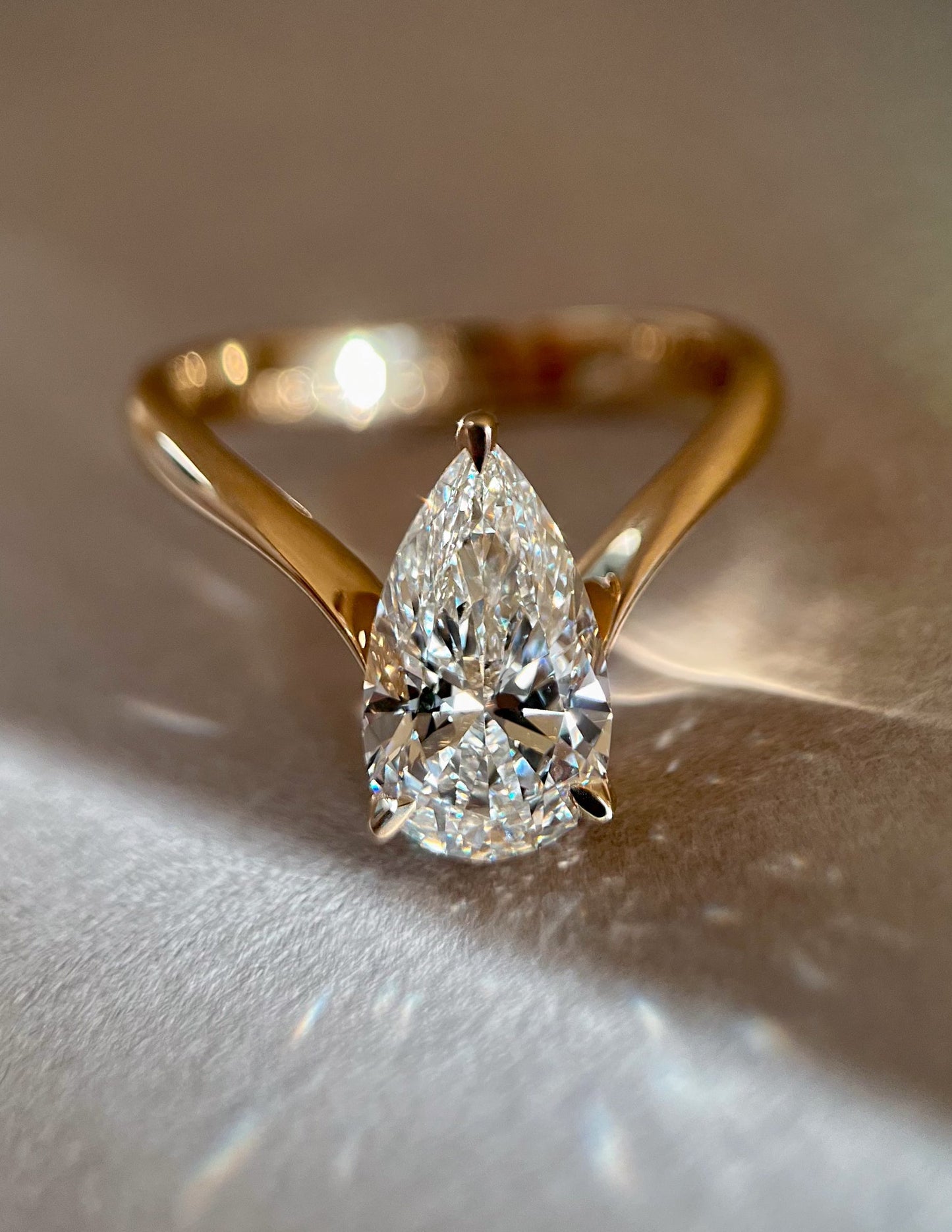 Solitaire V Curved Shank-Pear Lab Grown Diamond Engagement Ring - Front view