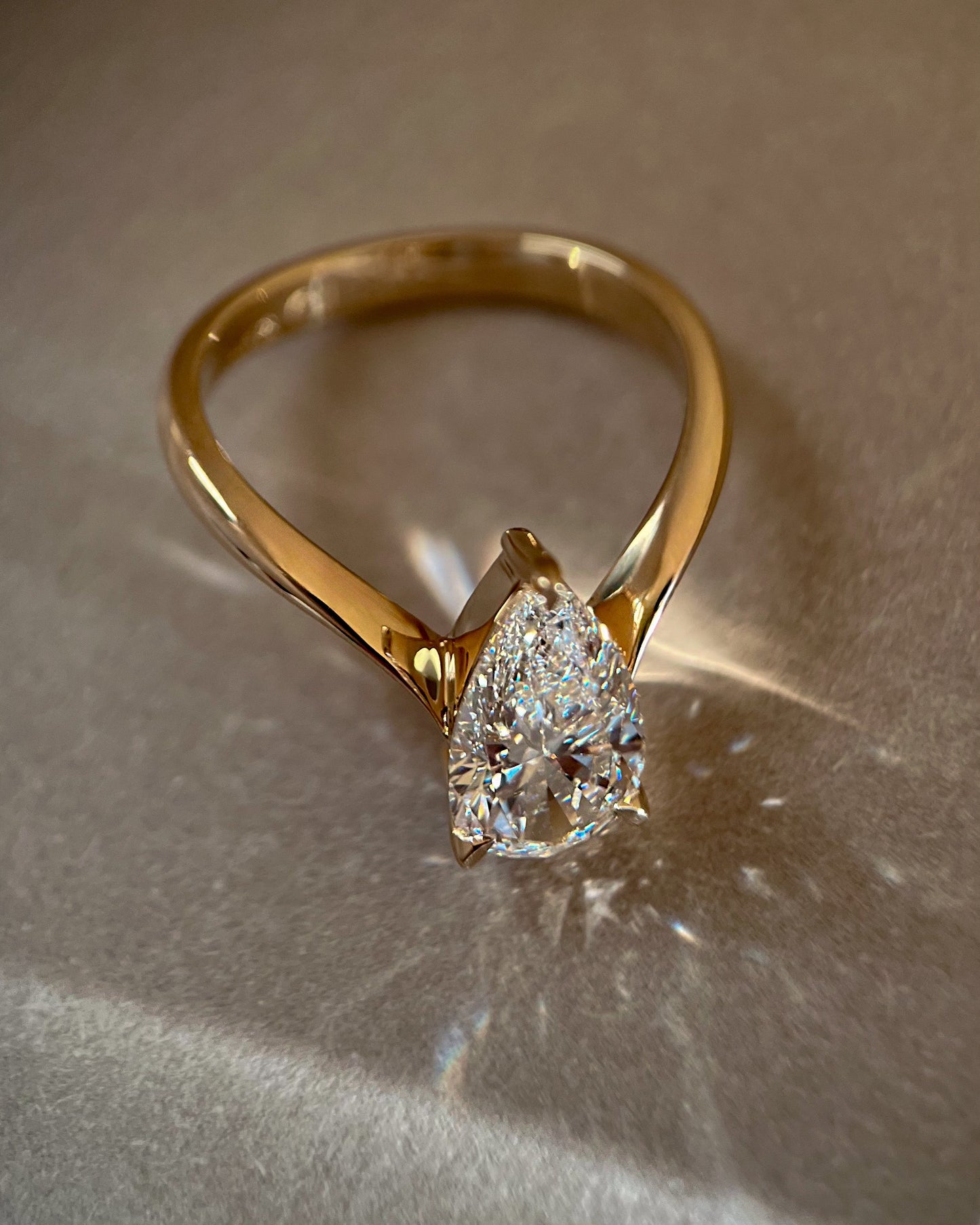 Solitaire V Curved Shank-Pear Lab Grown Diamond Engagement Ring - On model