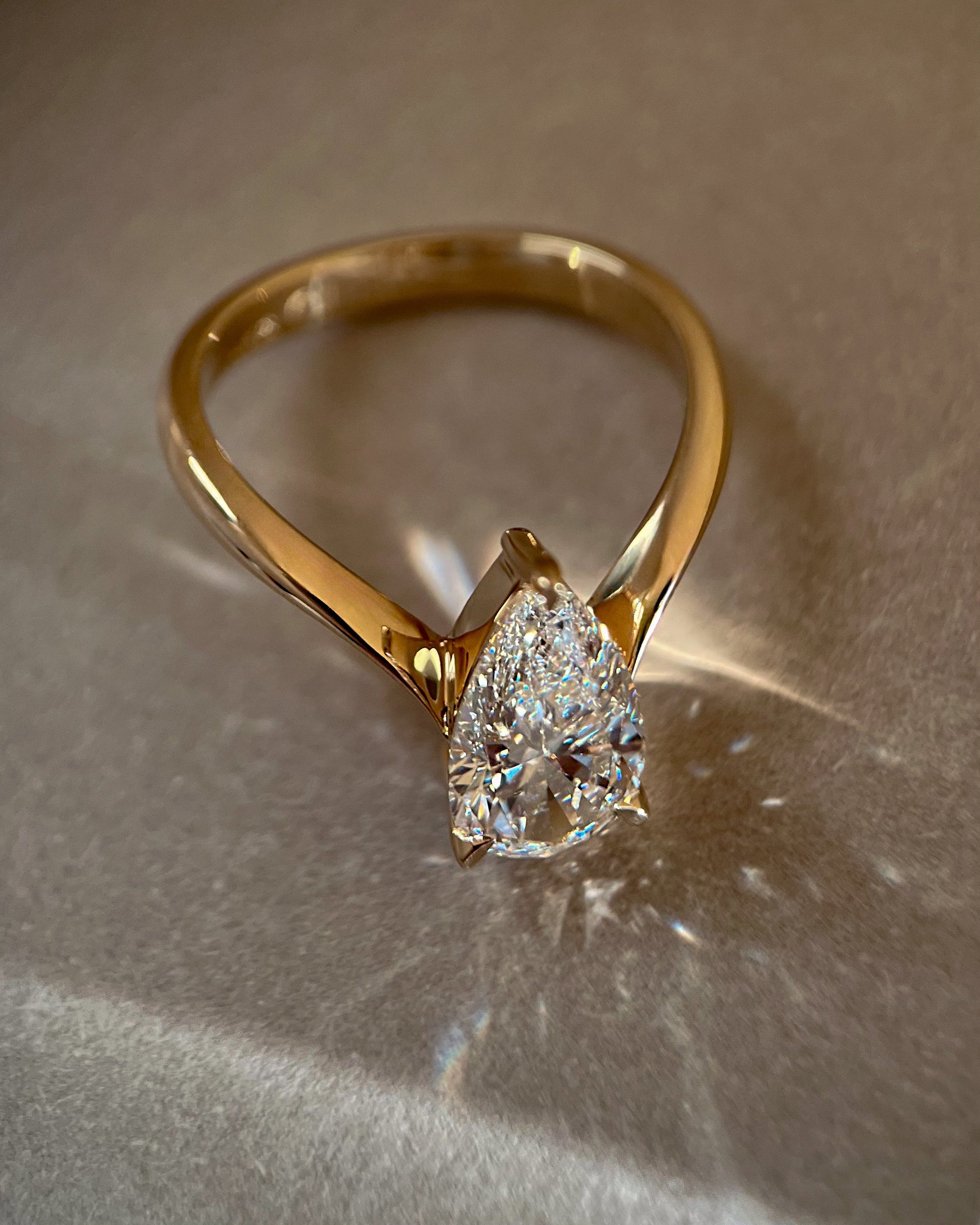 Solitaire V Curved Shank-Pear Lab Grown Diamond Engagement Ring - On model