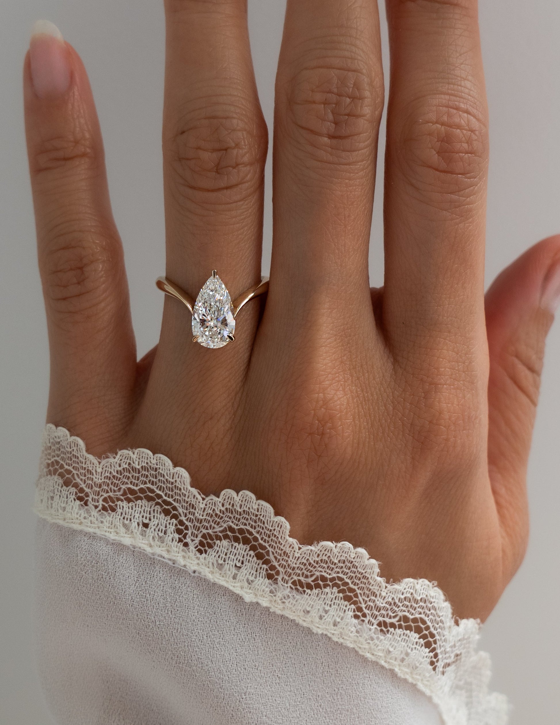 Solitaire V Curved Shank-Pear Lab Grown Diamond Engagement Ring - Front view