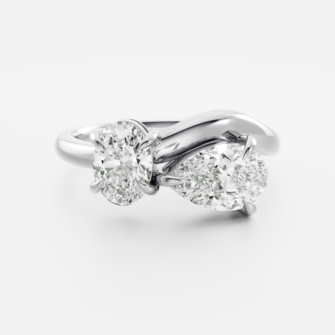 Toi Et Moi Curved- 1.25 CT Pear 0.95 CT Oval Moissanite Engagement RingToi Et Moi Curved- 1.25 CT Pear 0.95 CT Oval Moissanite Engagement Ring - On model