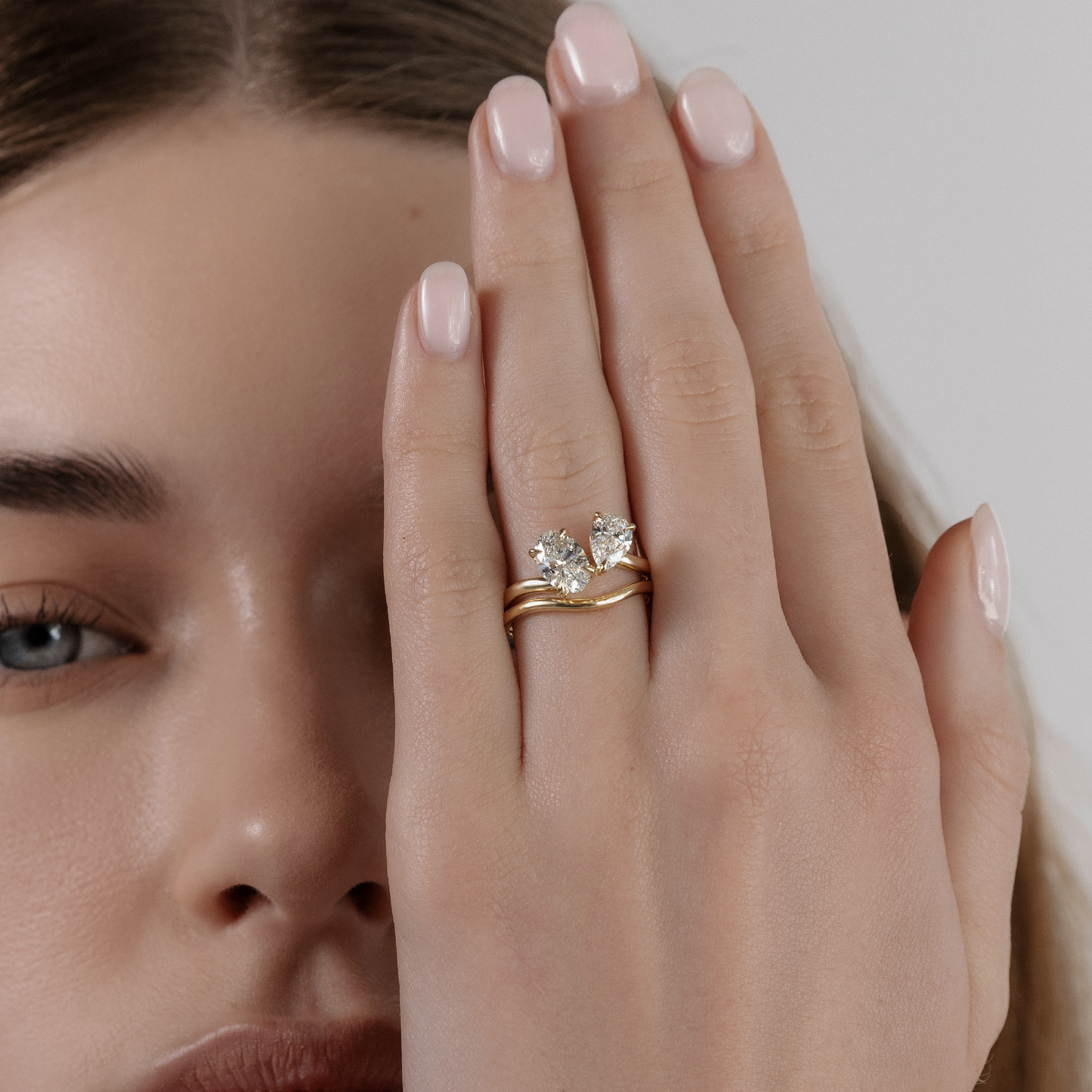 Toi Et Moi Curved- 1.3 CT Oval & 0.85 CT Pear Moissanite Engagement RingToi Et Moi Curved- 1.3 CT Oval & 0.85 CT Pear Moissanite Engagement Ring - Lifestyle